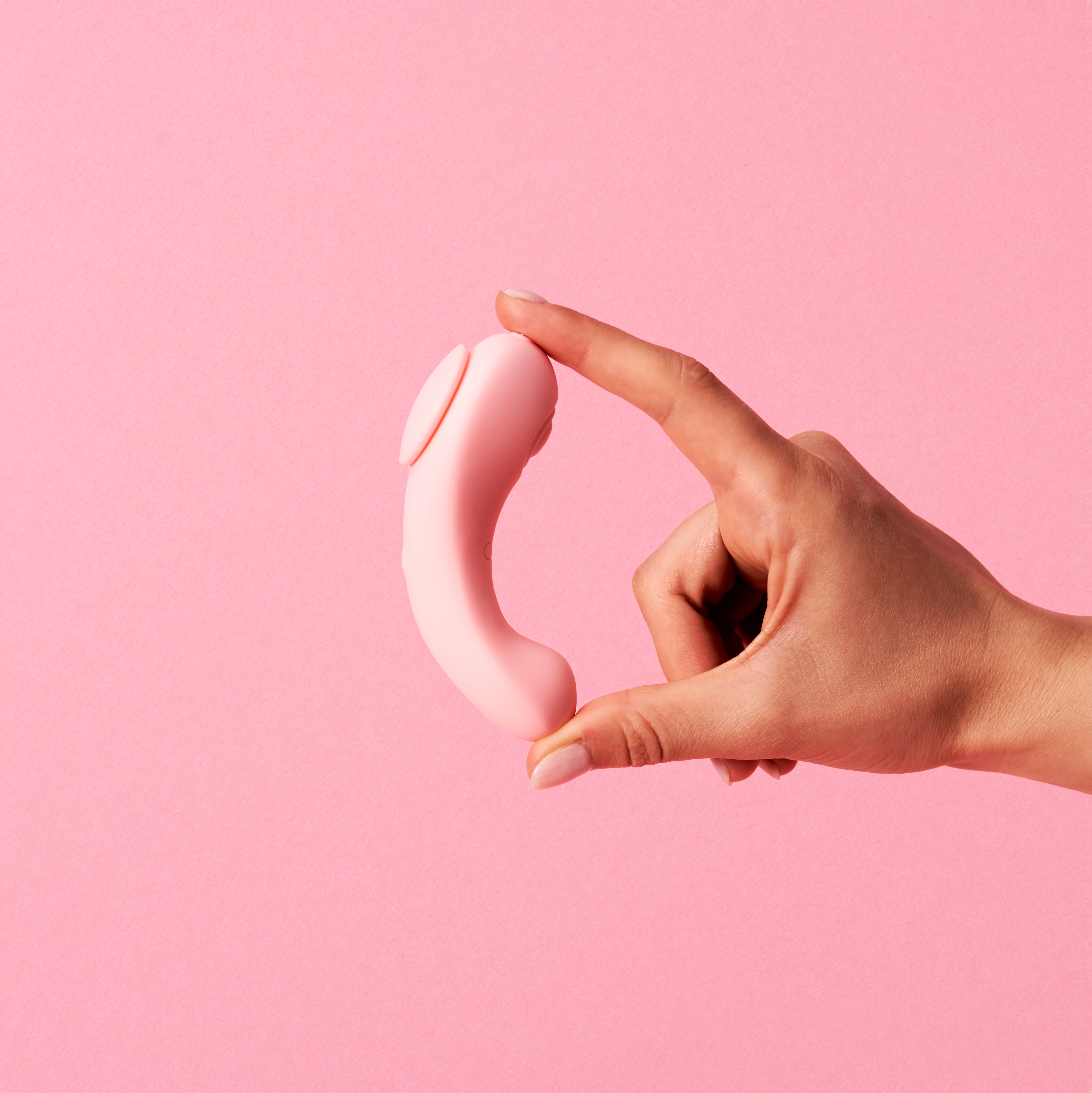 Pixie in hand — compact wearable design