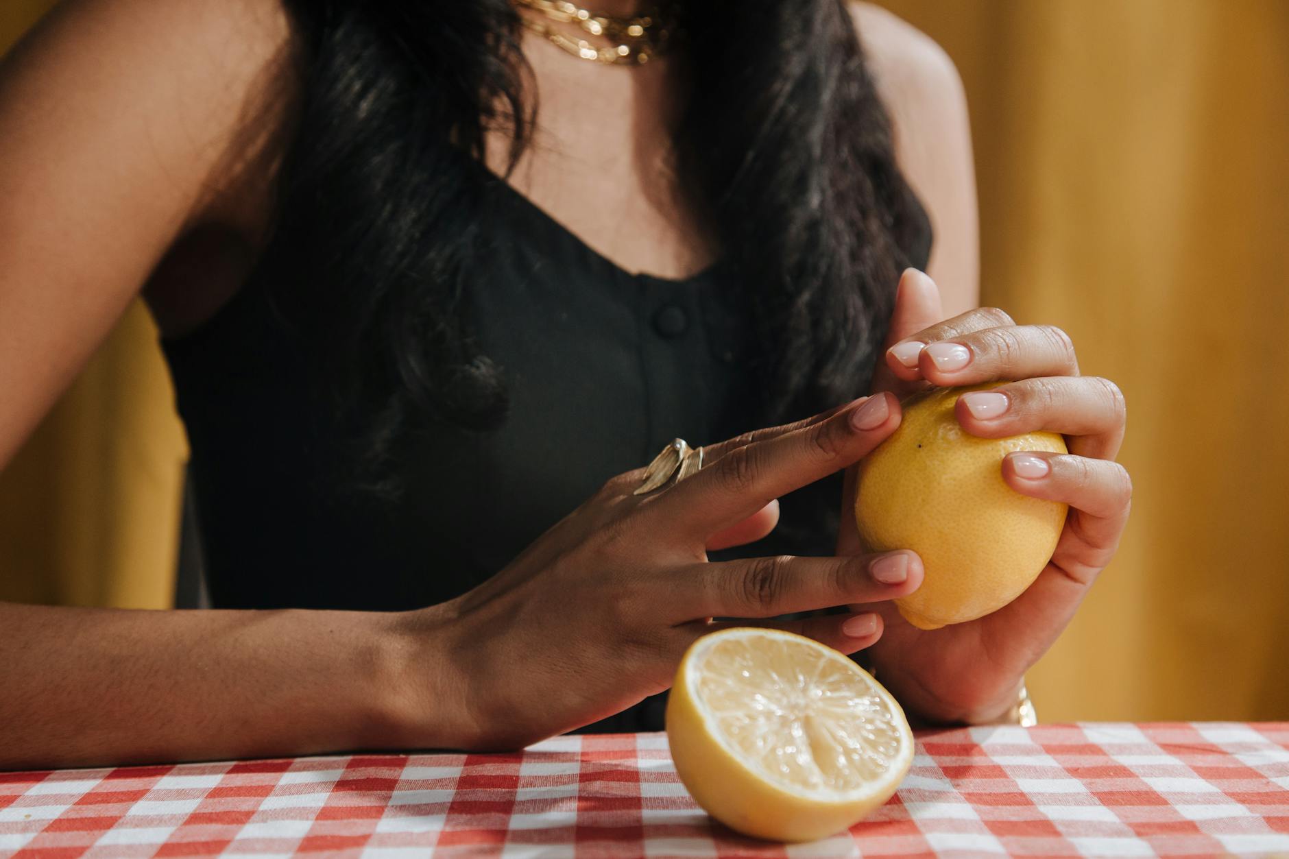 Bright ripe lemons on a yellow background