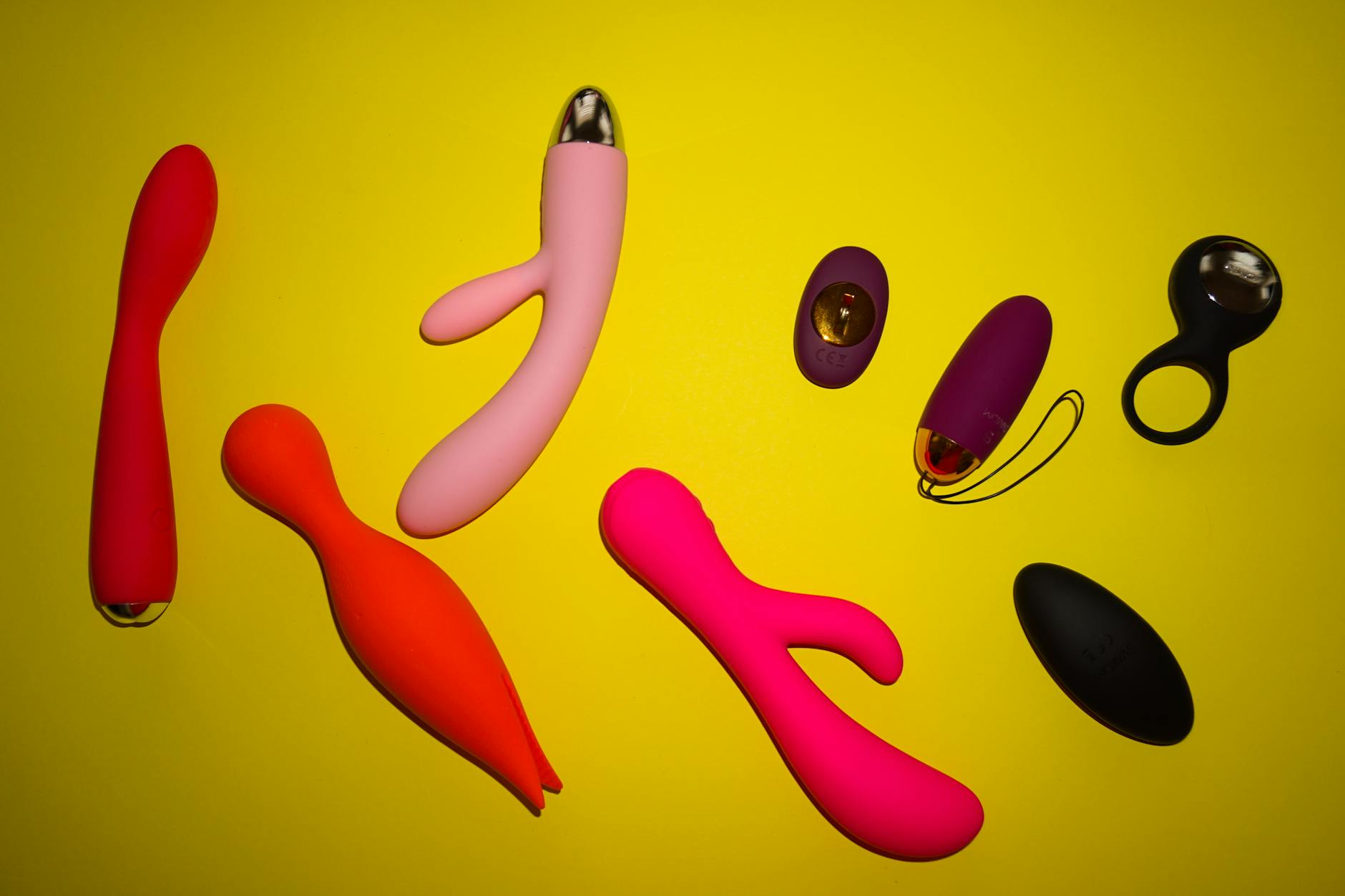 Woman contemplating adult toy choices with confidence and intention.