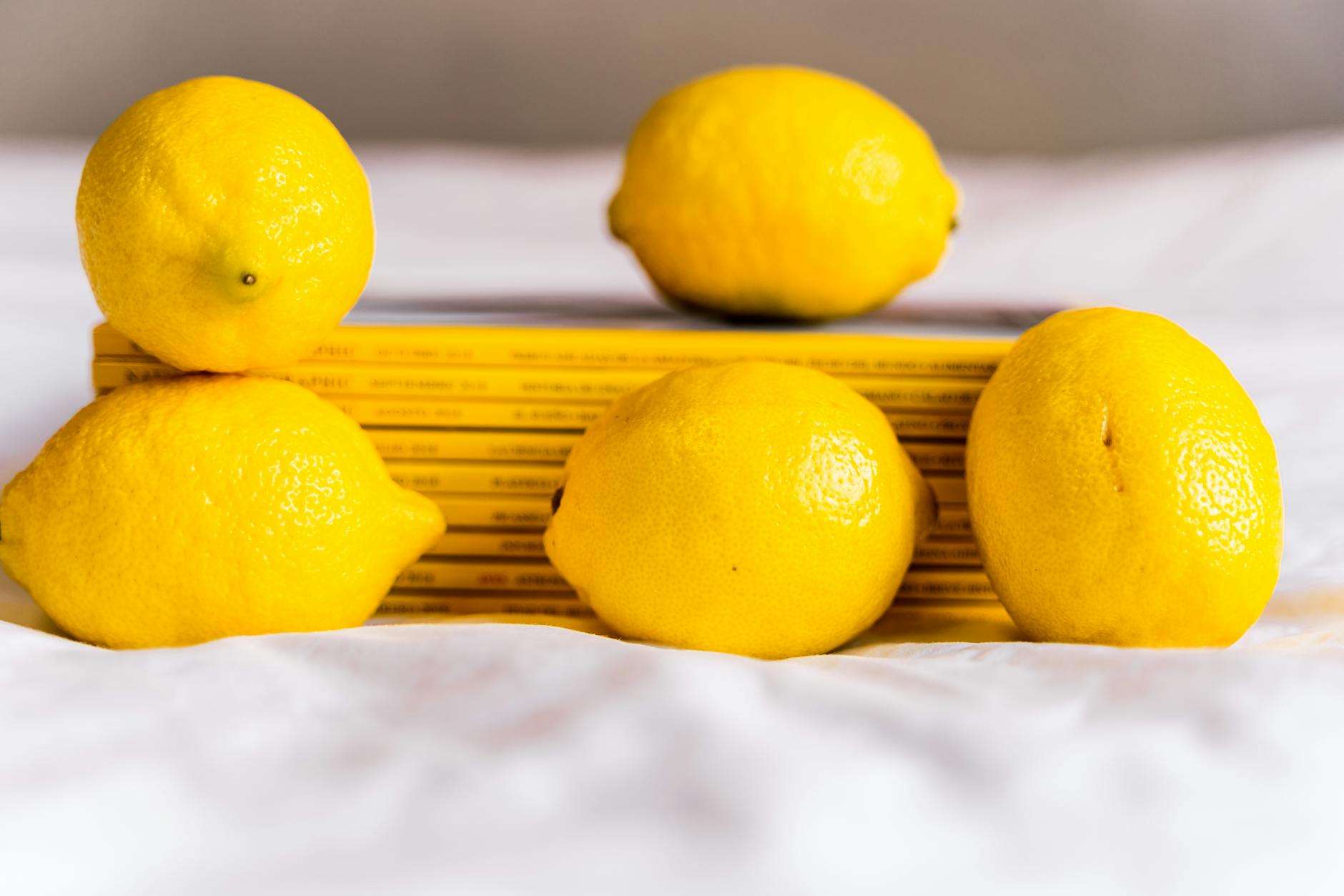 Two bright lemons against a white background